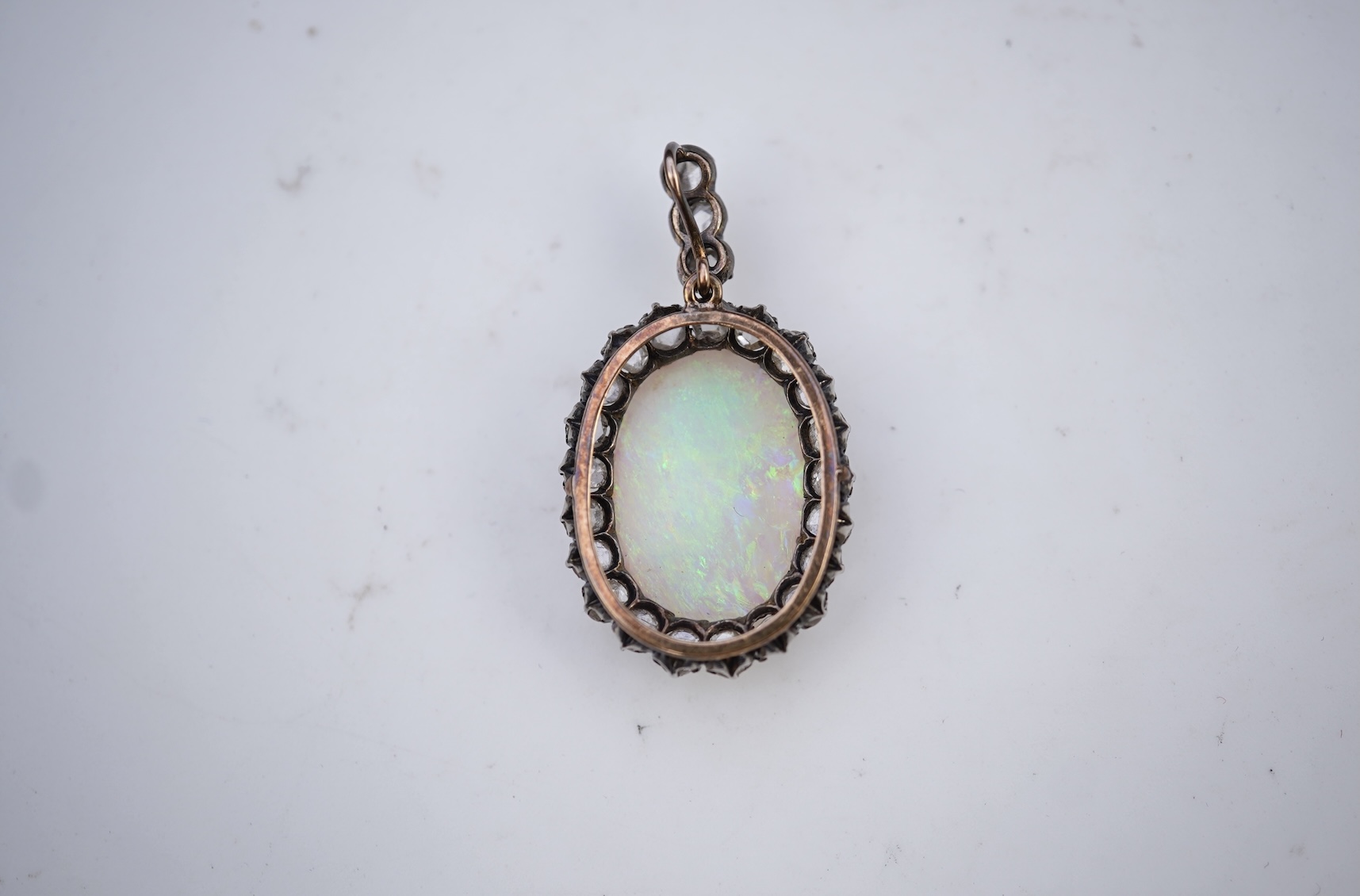 An opal and diamond pendant, early 20th century